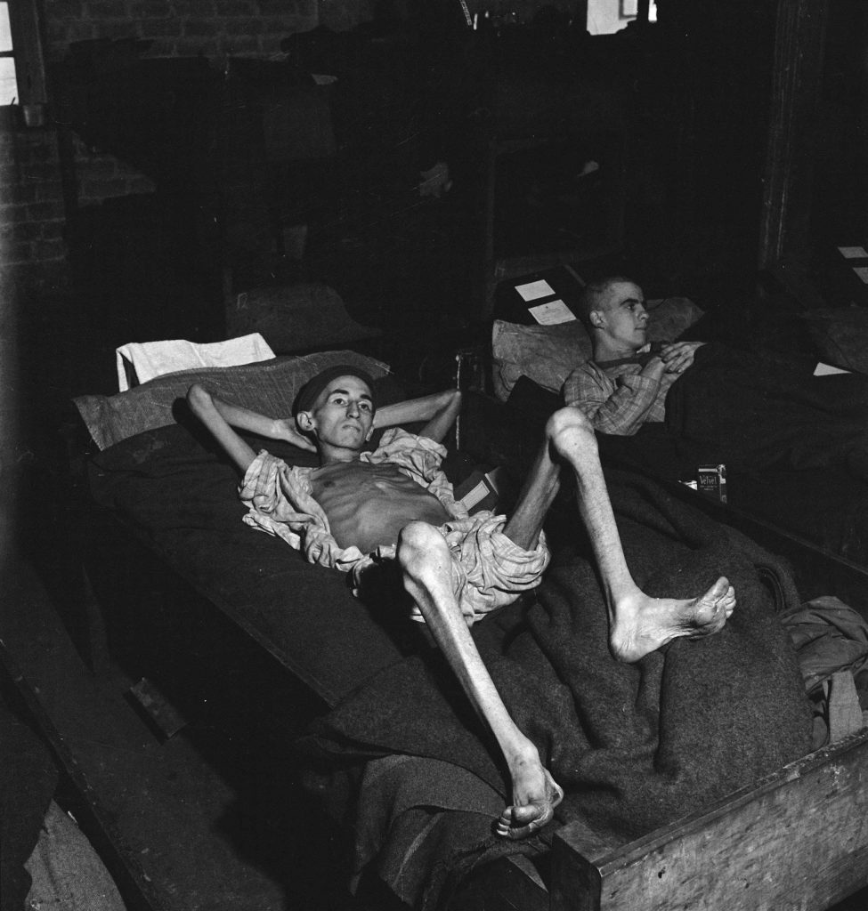 American Pvt. Joe Demler, photographed on the day that the notorious prison camp, Stalag 12-A in Limburg, Germany, was liberated by Allied troops, spring 1945.