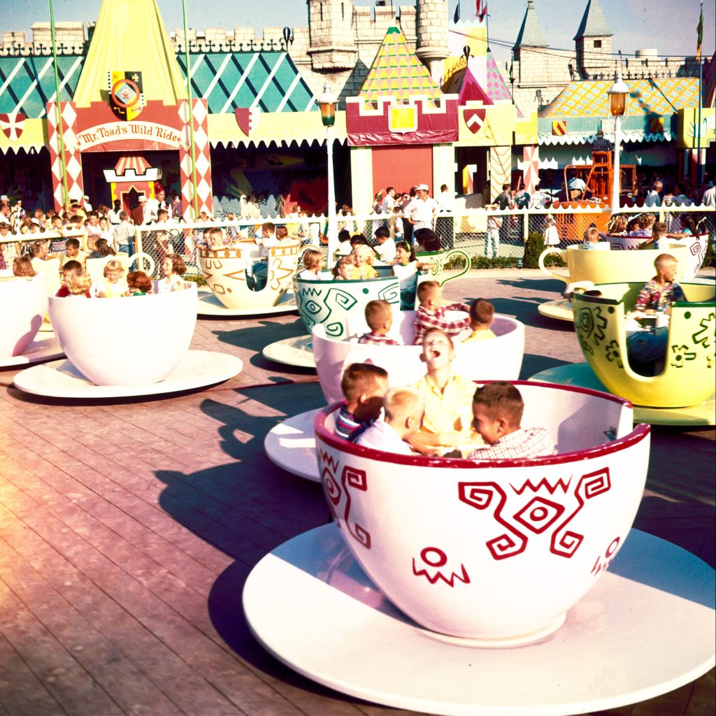 Cups and saucers filled with squealing children as paying guests while through park's Fantasyland at Disney's "Mad Hatter's Tea Party."
