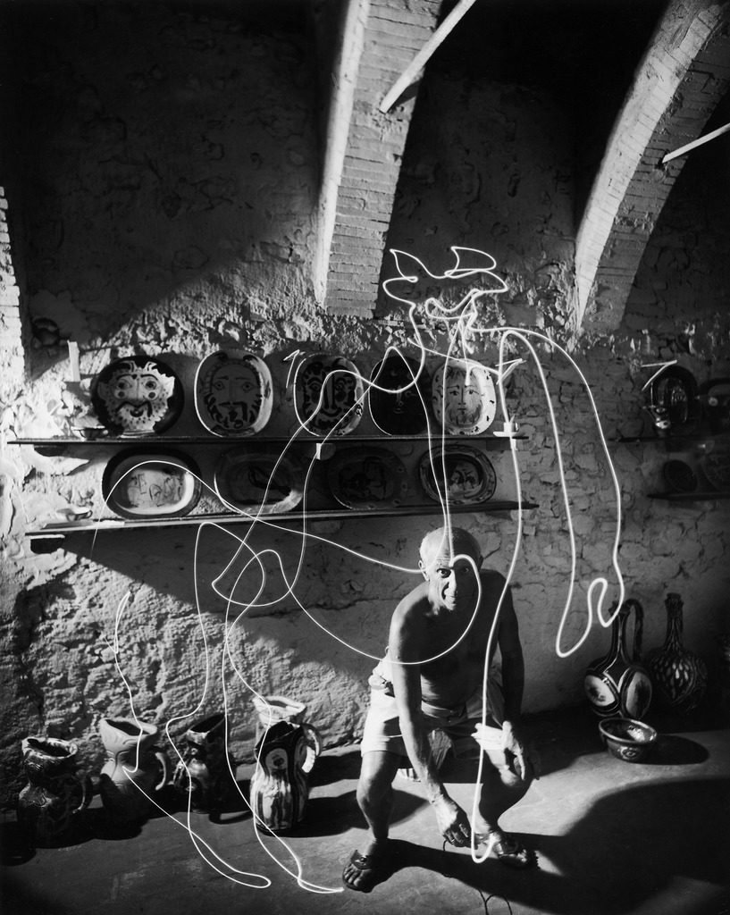 Artist Pablo Picasso using flashlight to make a light drawing in the air. (Photo by Gjon Mili/The LIFE Picture Collection)