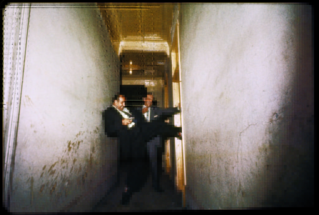 Detectives forcing their way into a suspicious room. (Photo by Gordon Parks/The LIFE Picture Collection © Meredith Corporation)